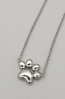 Sterling silver paw print necklace on adjustable chain