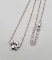 Sterling silver paw print necklace on adjustable chain